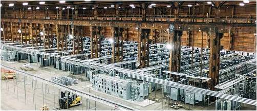 Modern cryptocurrency mining farm with rows of rigs