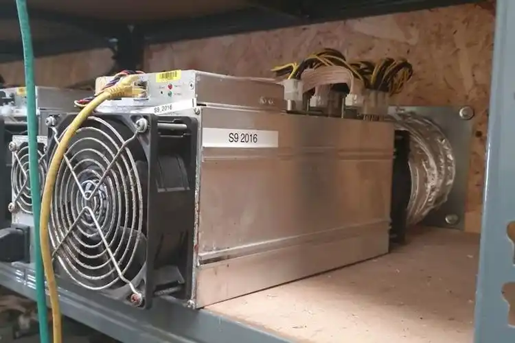 A large-scale cryptocurrency mining farm with rows of mining rigs.
